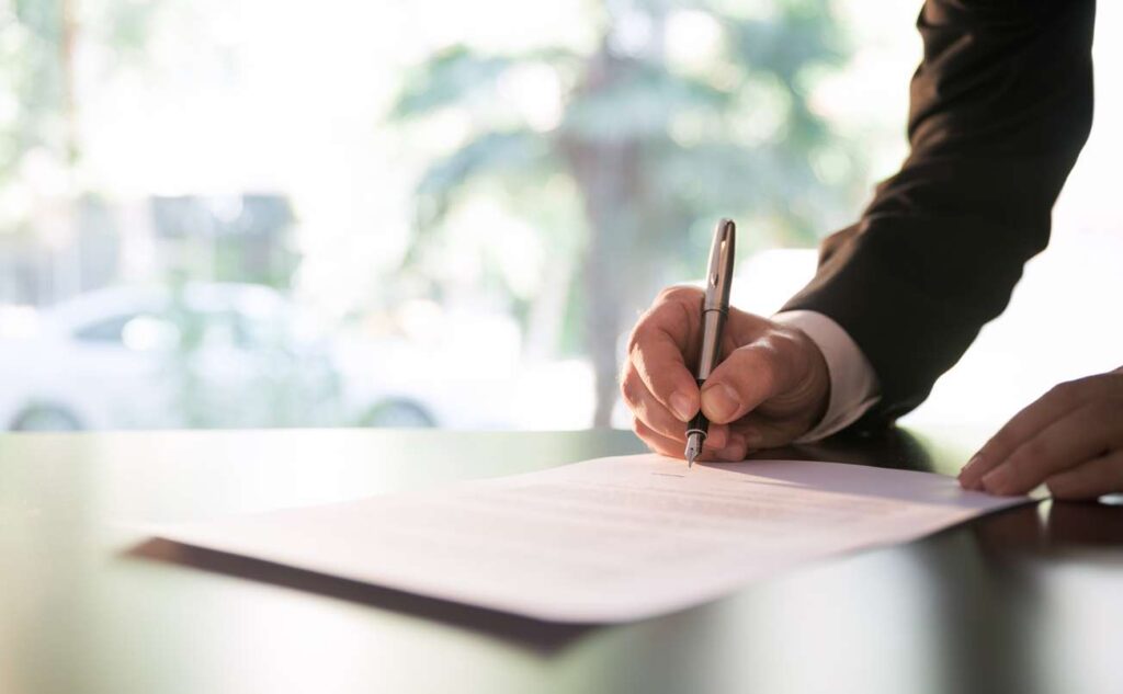 Businessman signing a contract or legal papers